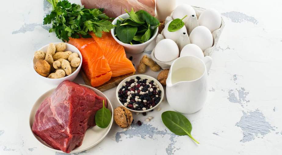 Building muscle requires a surplus of calories. The photo shows a variety of healthy, protein-rich foods.