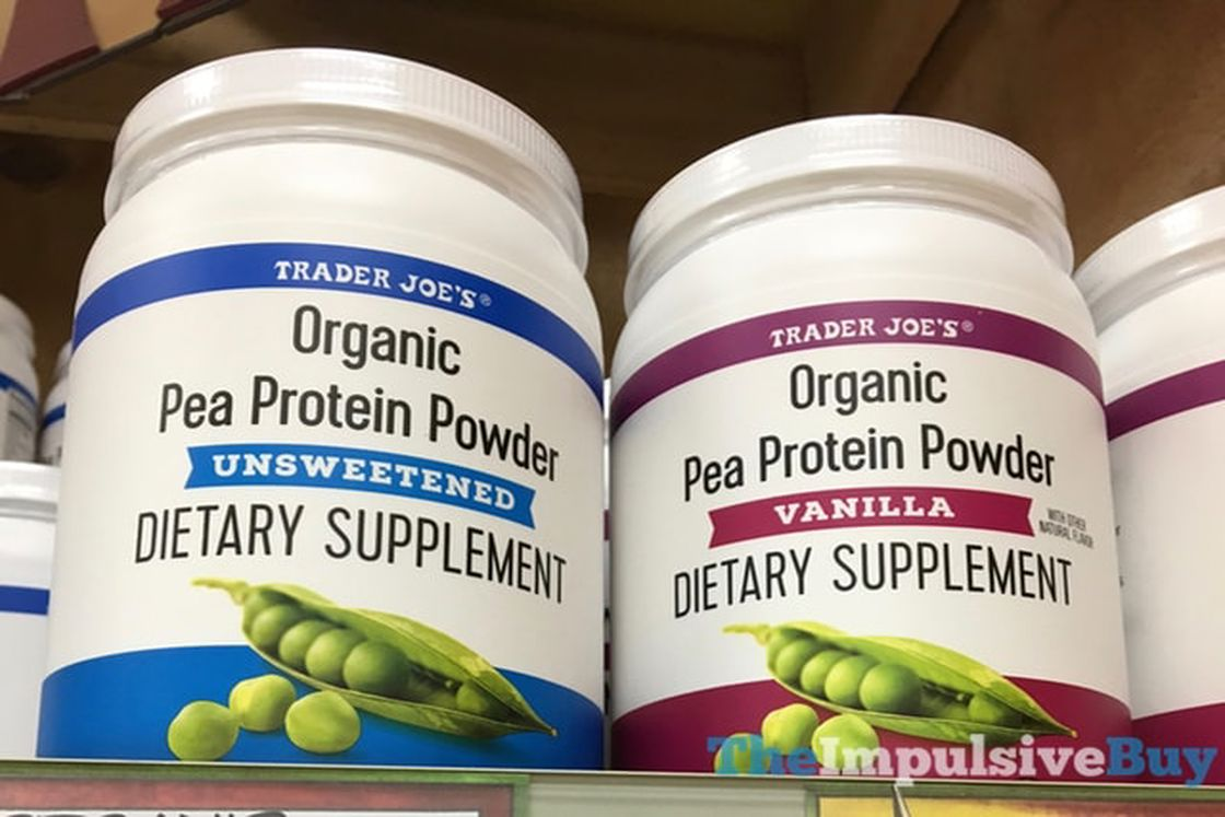 Two huge white bottles of Trader Joe's Organic Pea Protein Powder in different flavors