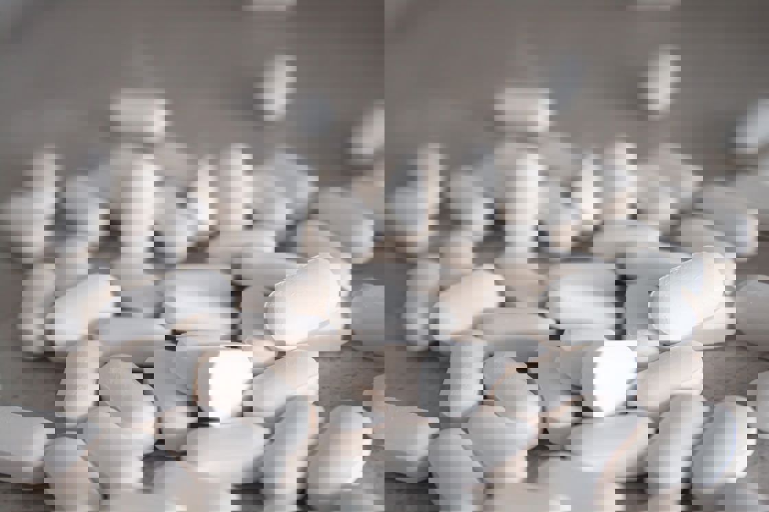 White pills scattered on the table