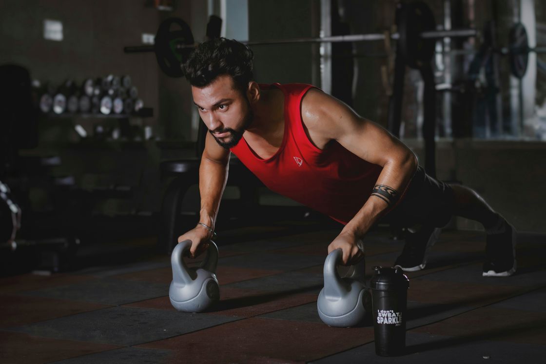 Man exercising using a pair of kettlebells