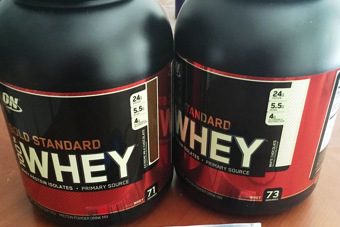 Two big bottles of Gold Standard Whey Protein Powder