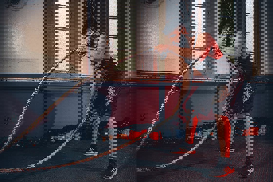 Man doing battle rope exercises