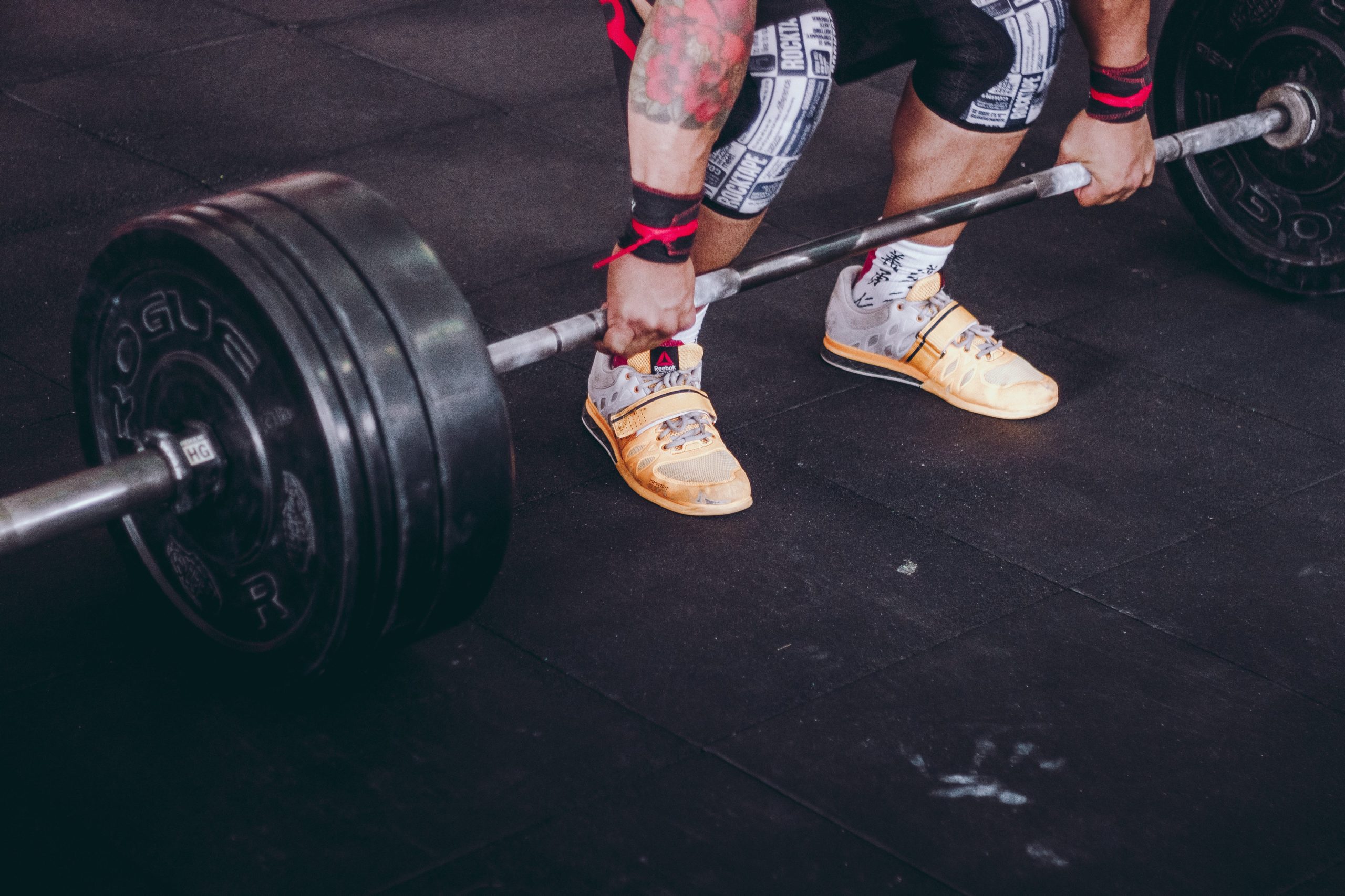 A man about to lift a barbell