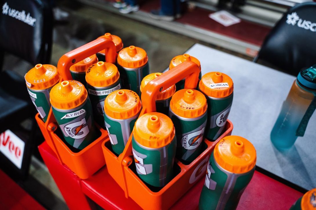 Green bottles of Gatorade stored in a carrier